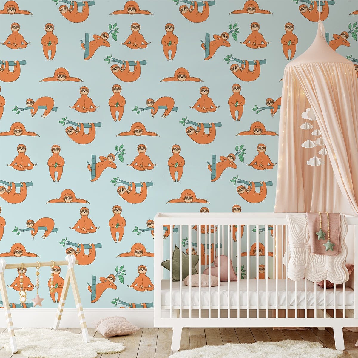 Playful orange sloth wallpaper in a nursery with a white crib and pink canopy, wooden flooring.