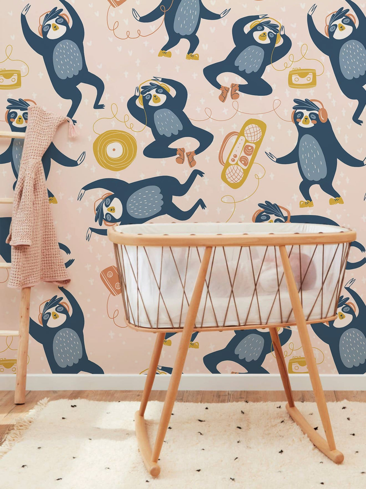 Playful Penguins mural wallpaper, wooden crib, pastel wall, nursery decor, playful pattern, cosy room.
