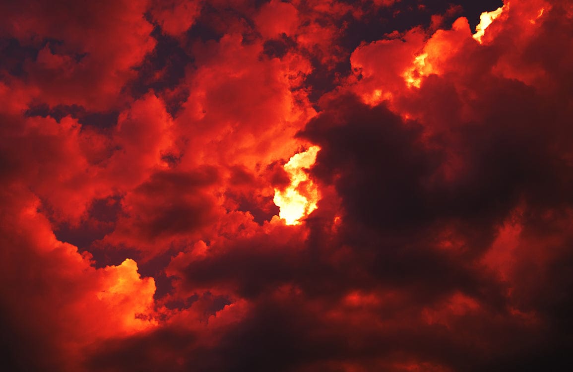 Fiery Sunset Cloudscape Mural Wallpaper in Vibrant Red and Orange Hues