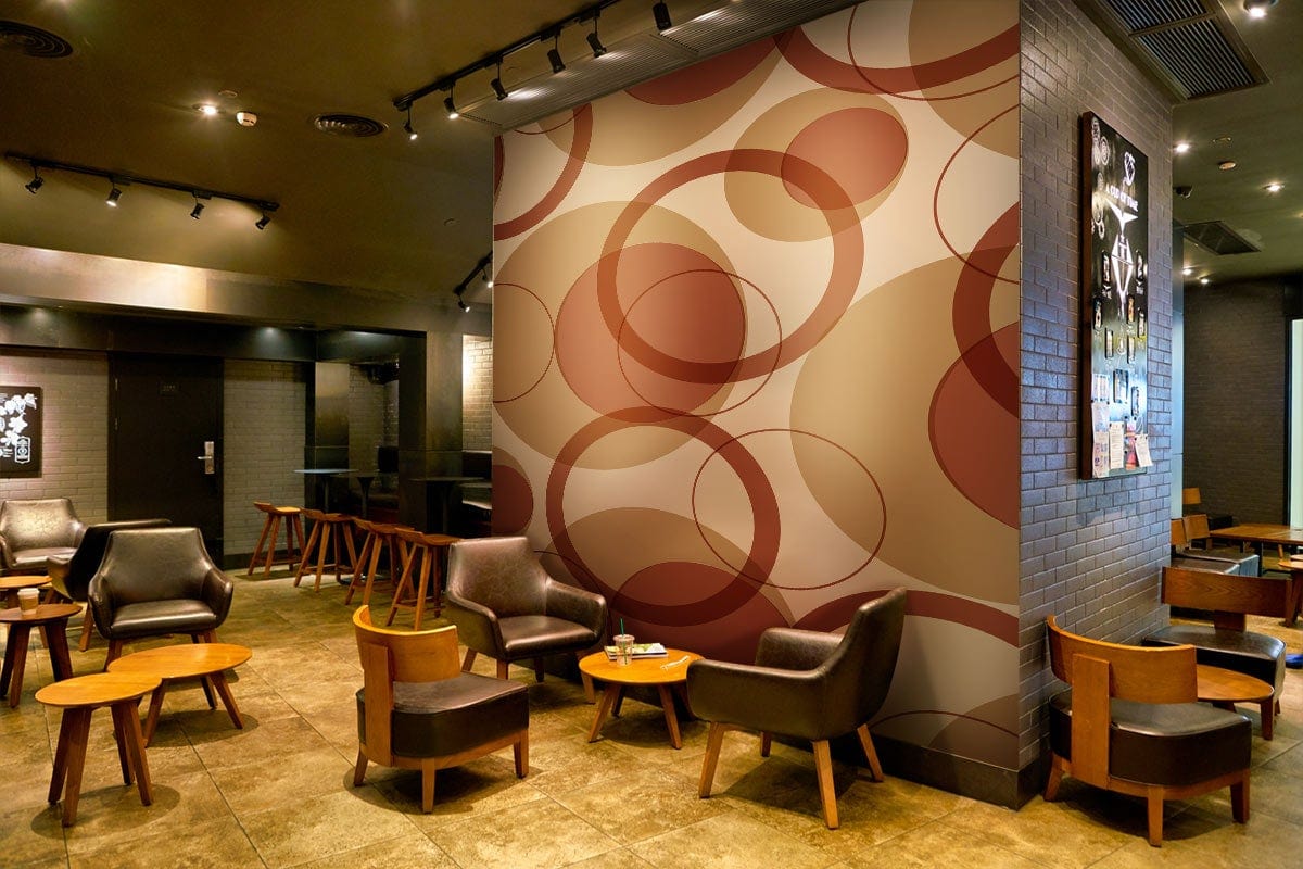 Retro Circles Autumn Tones Wallpaper in café lounge with brown leather chairs, wooden tables, tiled flooring.
