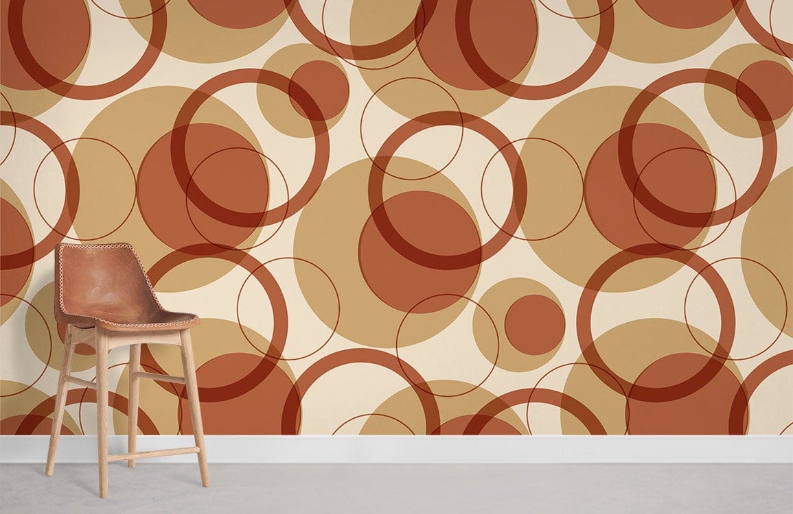 Retro Circles Autumn wallpaper with geometric pattern, tan leather chair, white skirting, concrete flooring.