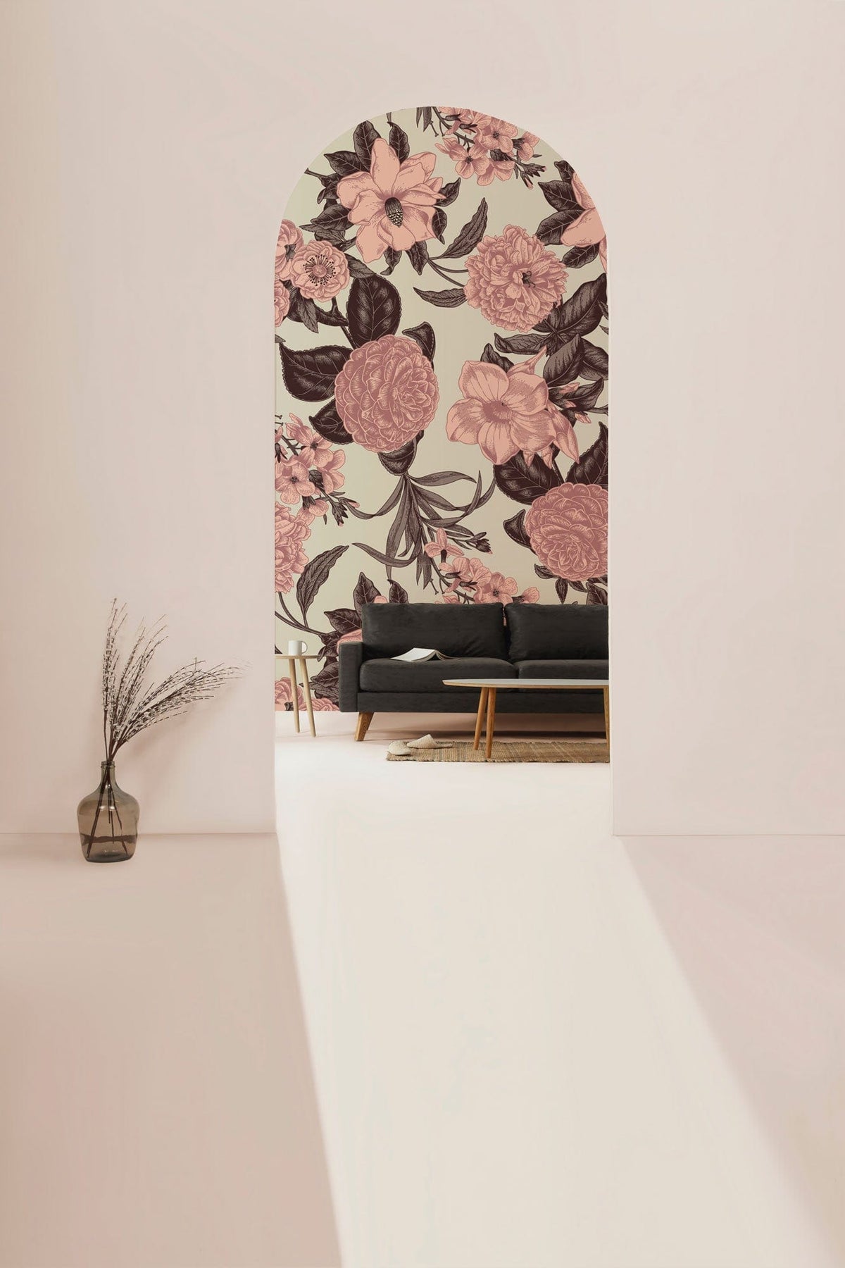 Soft pink and brown floral wallpaper in modern room, dark sofa, light flooring, elegant archway entrance.