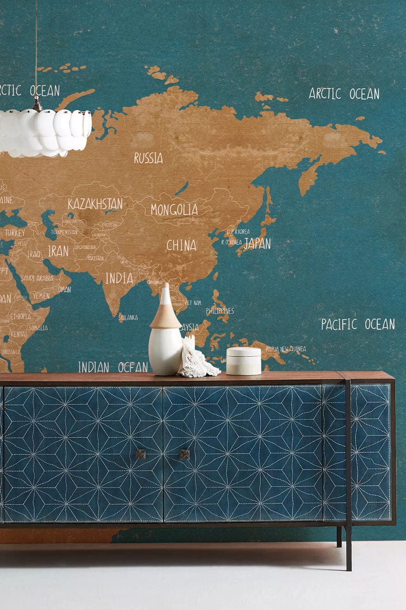 Vintage Blue and Tan World Map Mural Wallpaper with stylish geometric cabinet in modern room Décor.