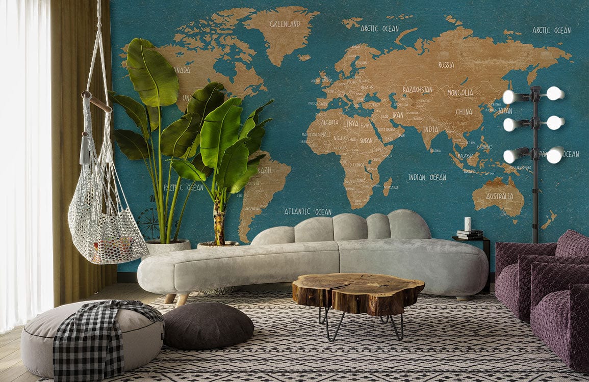 Vintage Blue Tan World Map Mural Wallpaper, elegant living room with grey sofa, rustic table, plants.