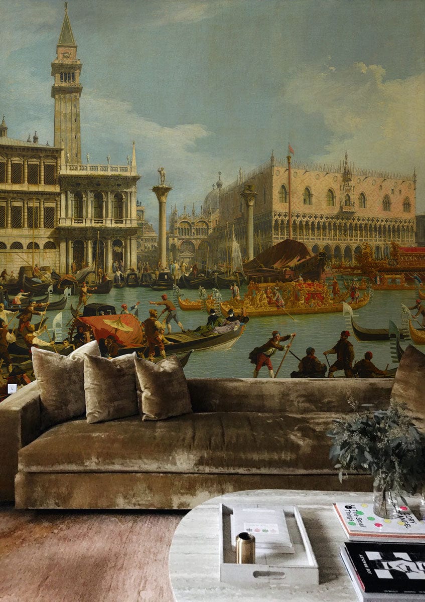 Velvet sofa with Historic Venetian Canal mural wallpaper, classic Italian artistry, wooden flooring, round table.