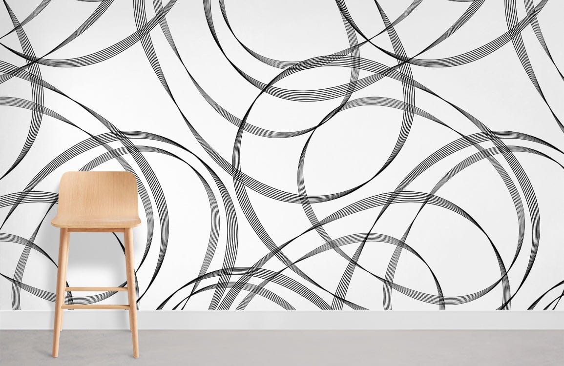 Monochrome swirl wallpaper with wooden chair on grey flooring in modern interior design setting.