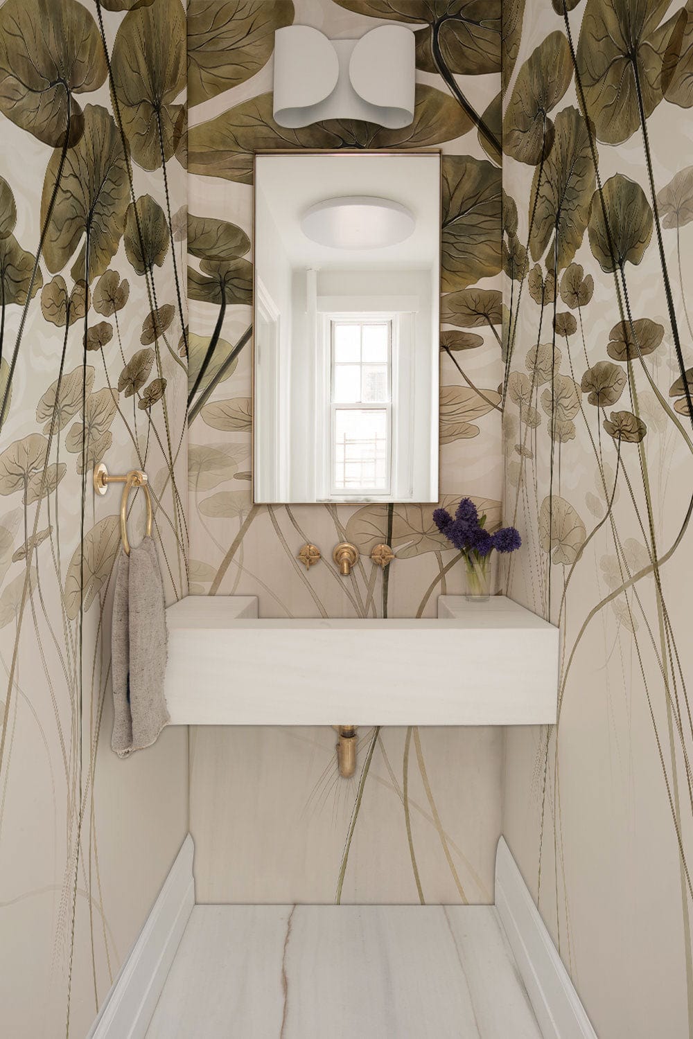 Serene Water Lilies mural wallpaper, earth tones, elegant bathroom, light sink, minimalist mirror, white flooring.