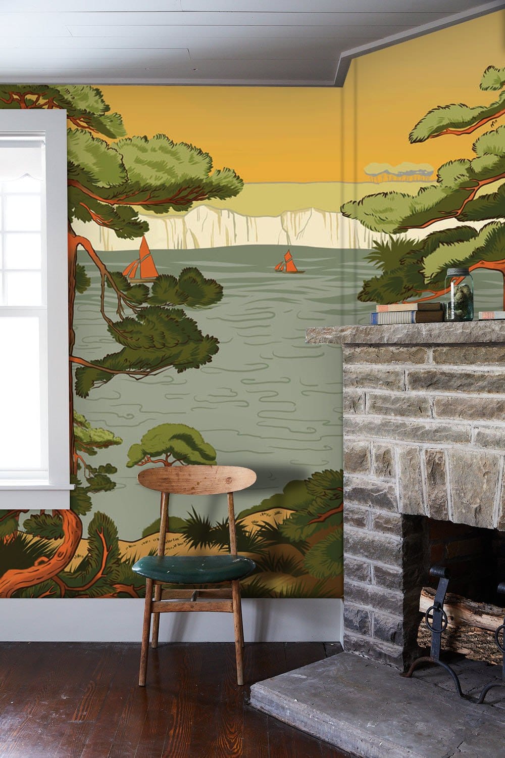 Vintage Coastal Pine Landscape Mural Wallpaper, earthy tones, stone fireplace, wooden chair, living room.
