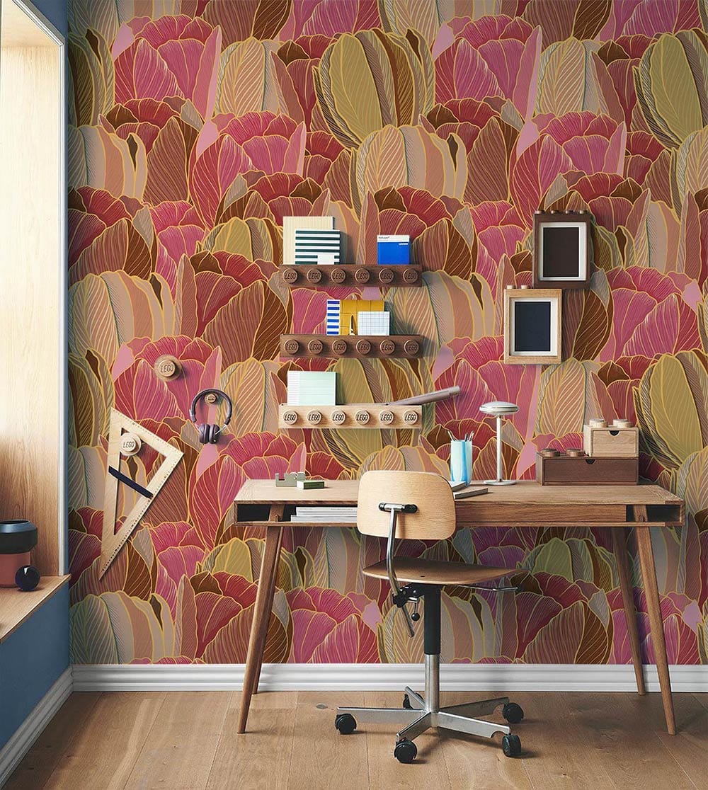Autumnal Hues Tulip Pattern Wallpaper in study room, wooden desk and chair, warm earthy floral backdrop.
