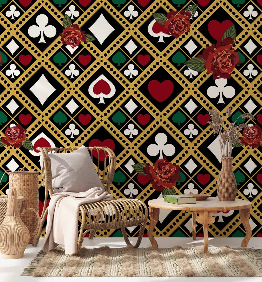 Rattan chair, rustic table, vintage card suit wallpaper with bold red rose accents, living room design.