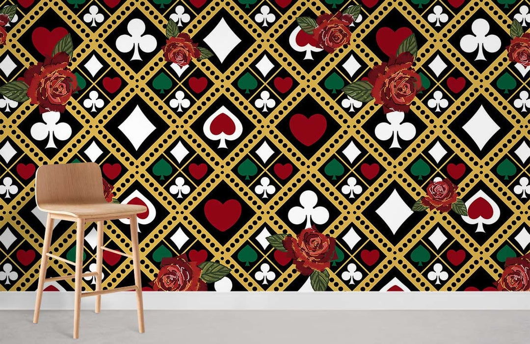Vintage card suit wallpaper with red rose accents and modern wooden stool on grey flooring.