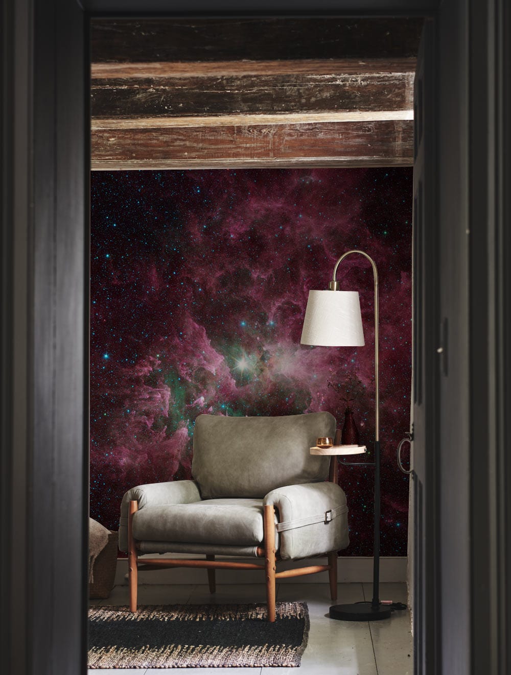 Galactic Nebula Stardust Mural Wallpaper in cosy living room with grey armchair and tall lamp.