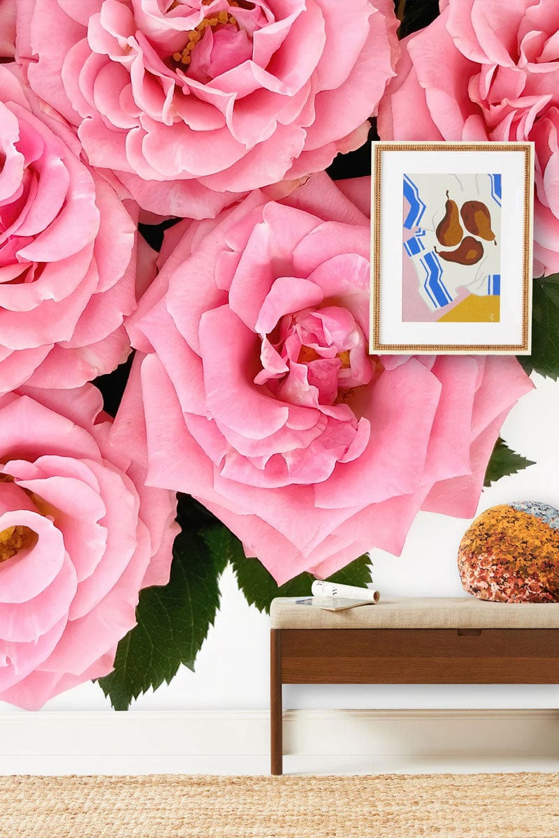 Elegant Pink Roses Floral Wallpaper with art print, wooden table, and neutral flooring in living room.