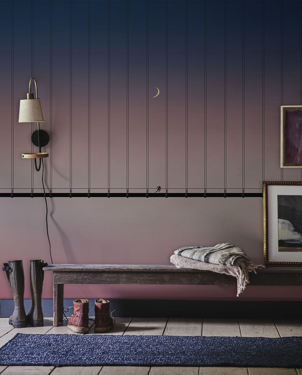 Serene Dusky Bridge Mural Wallpaper in elegant blue-pink gradient; rustic bench; entryway decor.