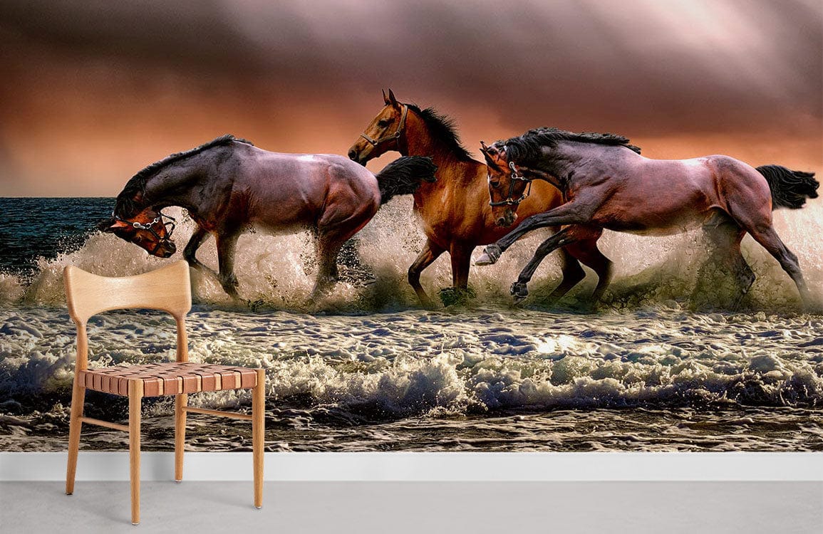 Majestic horses in dramatic seaside mural wallpaper, wooden chair, ocean waves, sunset scene, serene atmosphere.