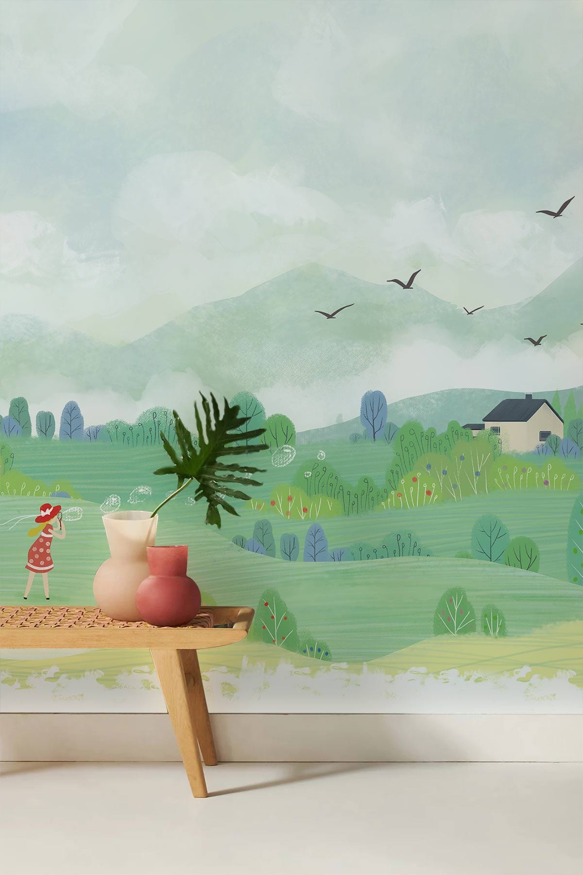 Whimsical countryside mural wallpaper with soft green hues, wood bench, decorative vases, serene landscape.