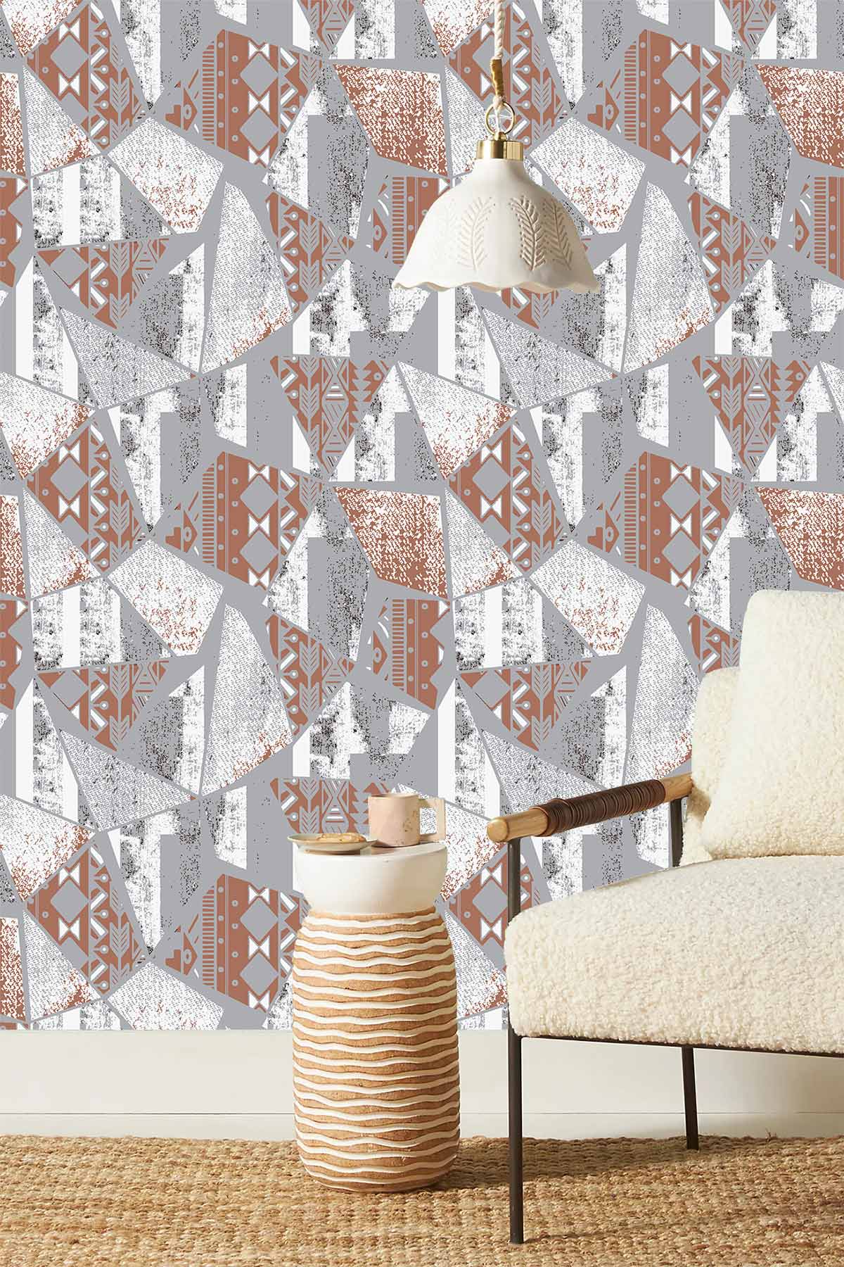 Abstract geometric terracotta and grey patterned wallpaper, modern chair, woven rug, unique lighting.