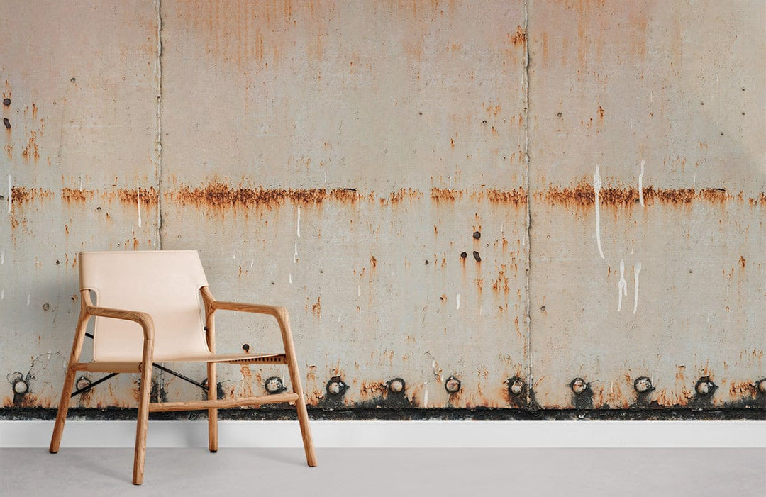 Industrial Urban Rusted Metal Wall Mural with beige tones, wooden chair, grey flooring in room.