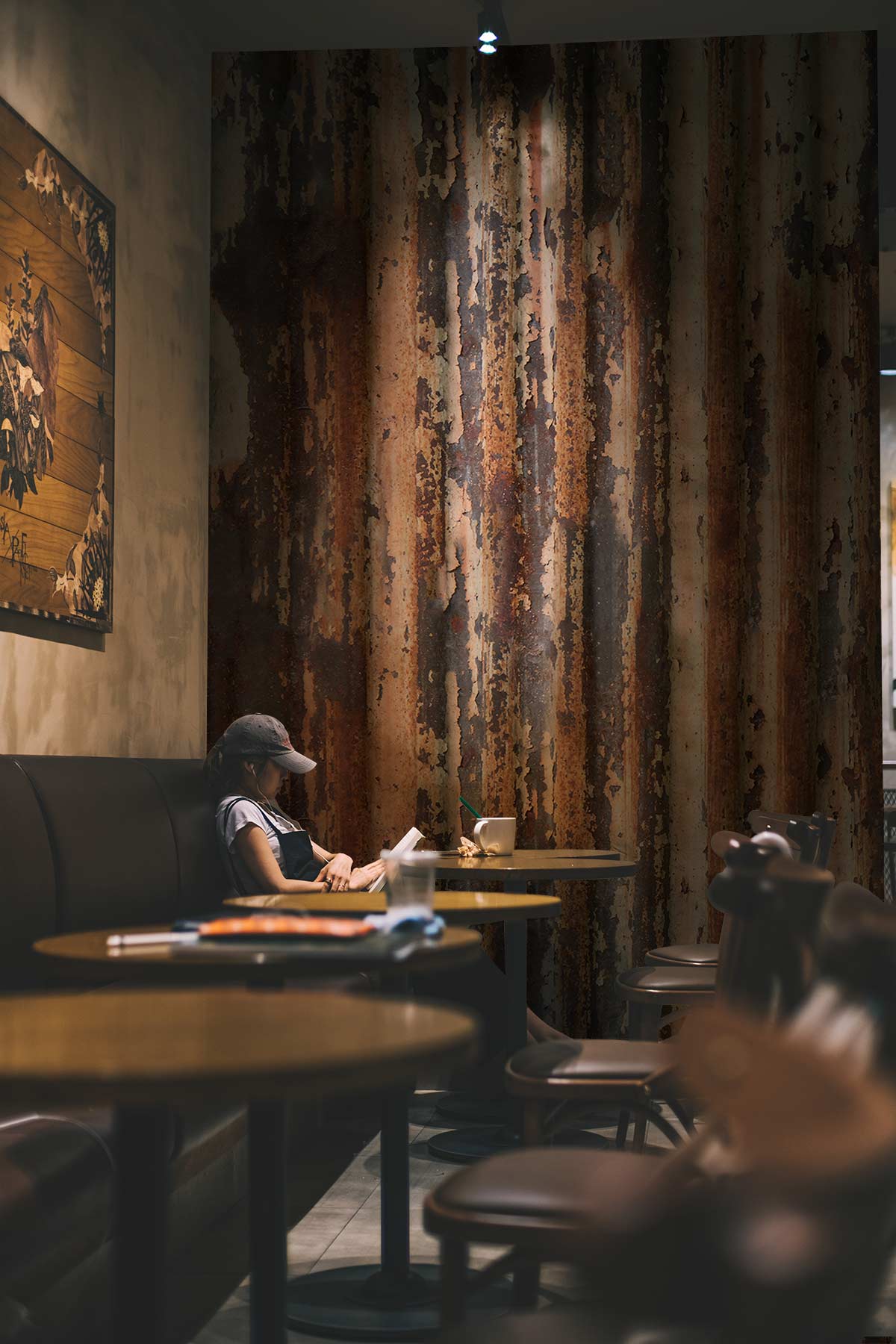 Vintage rustic industrial wallpaper in café setting with brown seating and wooden tables; atmospheric ambiance.