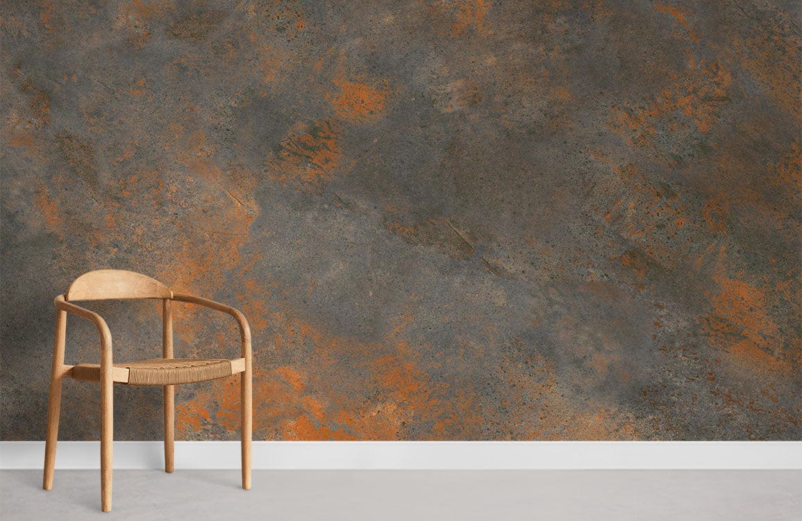 Rustic industrial textured wallpaper with earthy orange tones, paired with a wooden chair on concrete flooring.