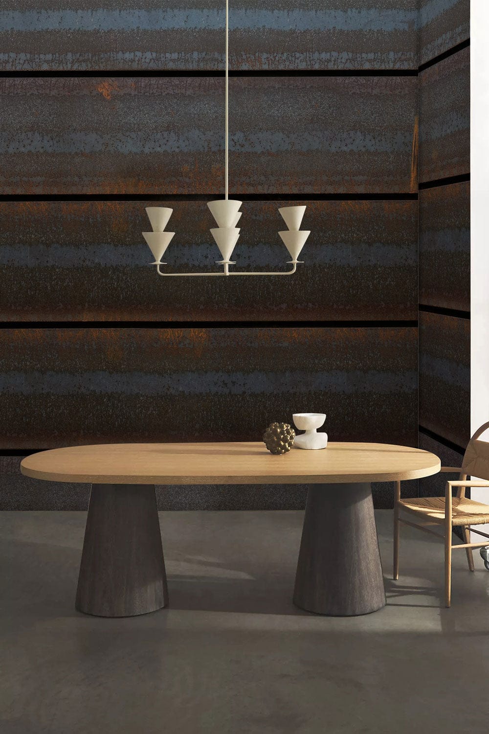 Rustic industrial wallpaper by Brand, blue-brown tones, dining room with modern table, grey flooring.