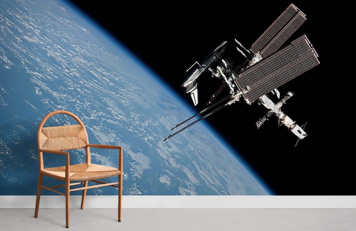 Space Station in Orbit mural, Earth view, rattan chair, white flooring, wall art Décor in living room.