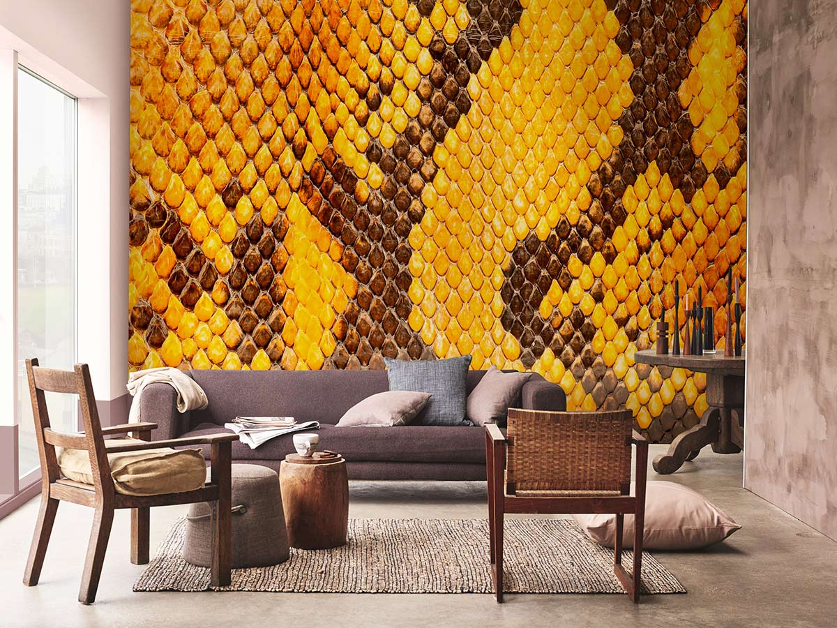 Exotic golden snake mural wallpaper, modern sofa, rustic furniture, concrete flooring in stylish living room.