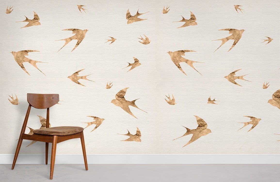 Vintage Swallow Flight Wallpaper in rustic beige bird pattern with wooden chair on concrete floor.
