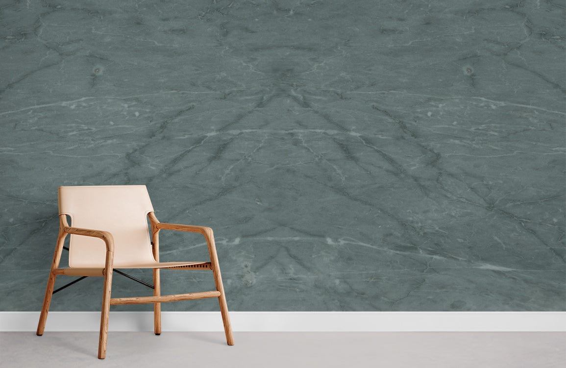 Elegant green marble effect mural wallpaper with beige wooden chair in modern interior setting.