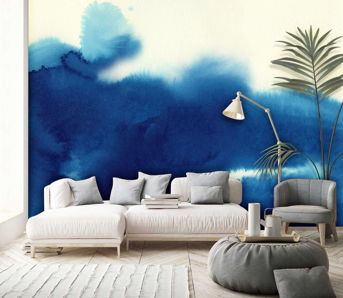 Oceanic Watercolour Blue Abstract Mural Wallpaper in living room with white sofa, modern decor, wooden flooring.