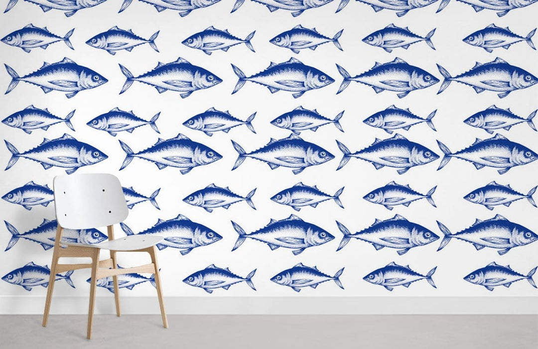 Nautical blue fish pattern wallpaper with white modern chair, coastal decor, minimalist room setting.