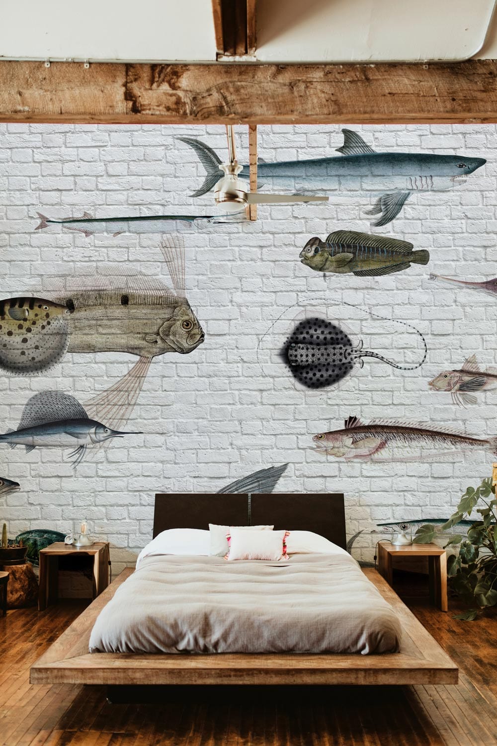 Vintage Aquatic Adventure Brick Wall Mural with Colourful Sea Creatures, rustic bedroom, wooden flooring.