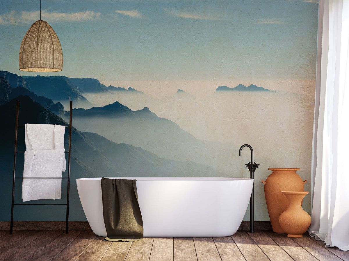 Tranquil blue mountain mural with freestanding bath, wooden flooring, wicker lamp in elegant bathroom.