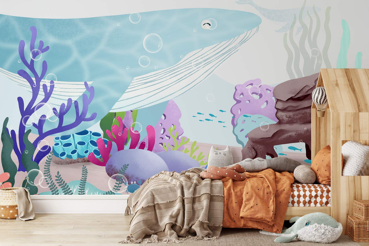 Underwater Adventure Mural Wallpaper with blue whale, coral; wooden bed; children's room; light wood flooring.