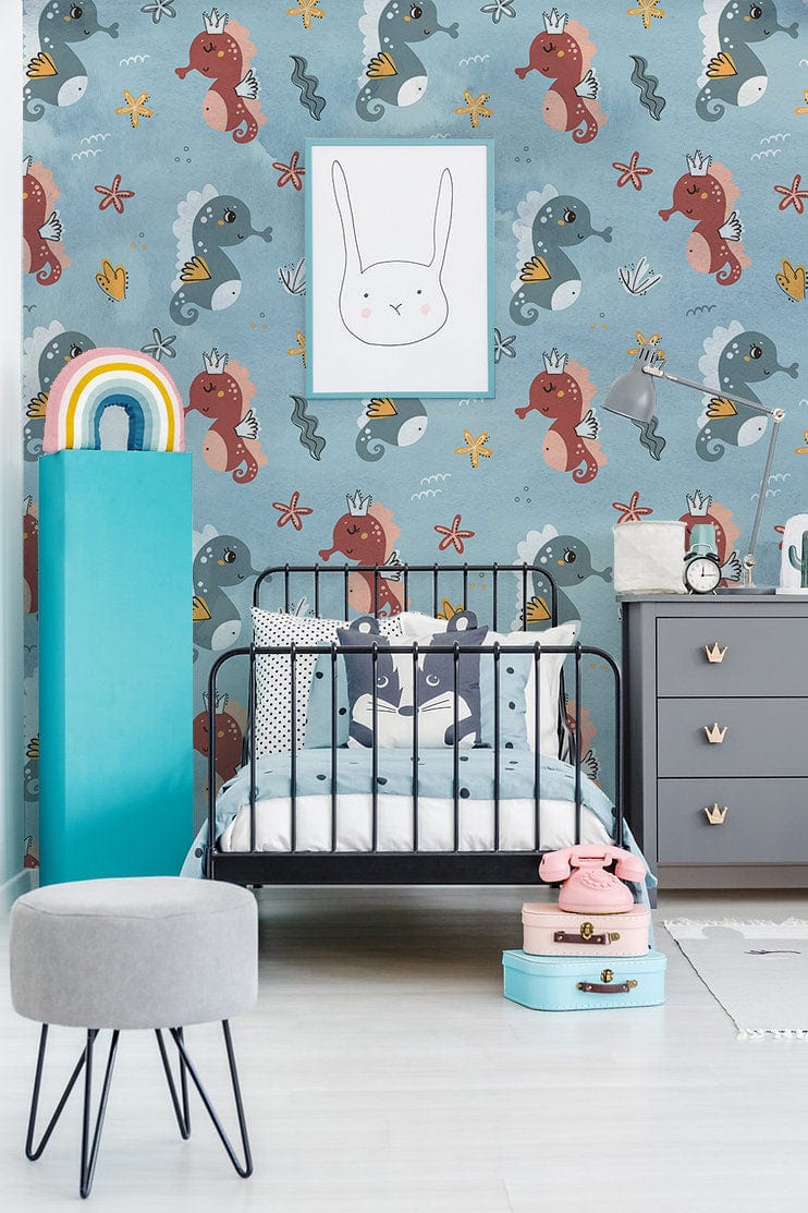 Adorable Seahorse Adventure Blue Kids' wall covering in child's room with grey dresser, stool, and art.
