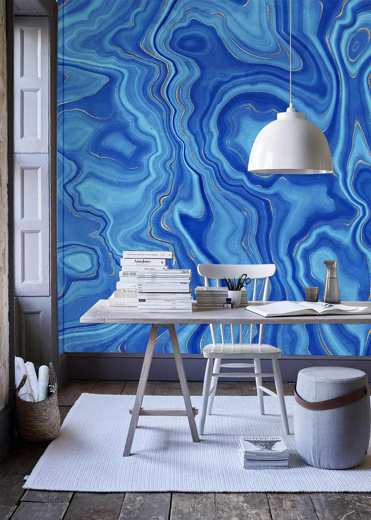 Elegant blue marble wallpaper in modern dining room with white chair, wooden table, grey flooring.