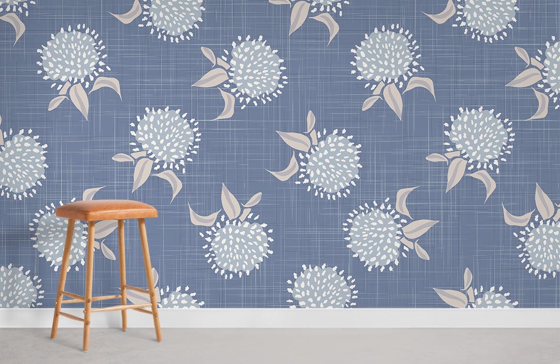 Elegant floral wallpaper in blue with accents, wooden stool, beige flooring, suitable for lounge.