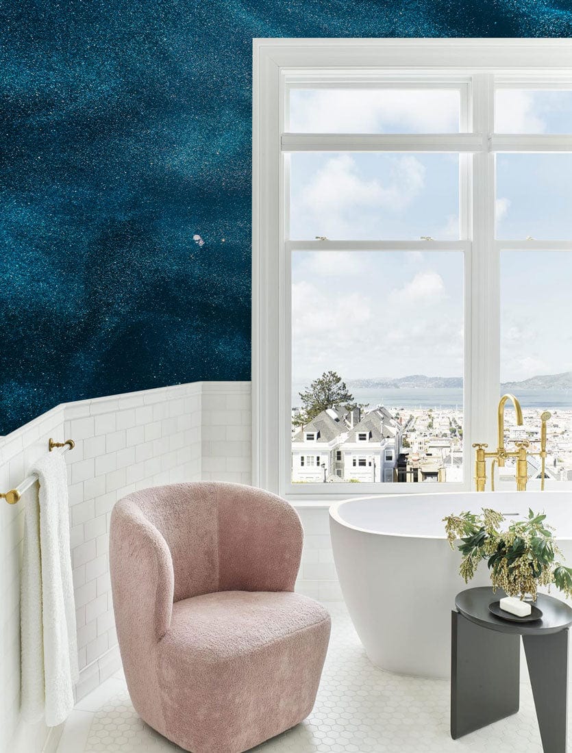 Midnight Ocean Blue Abstract Textured Wallpaper in elegant bathroom setting with plush pink chair.