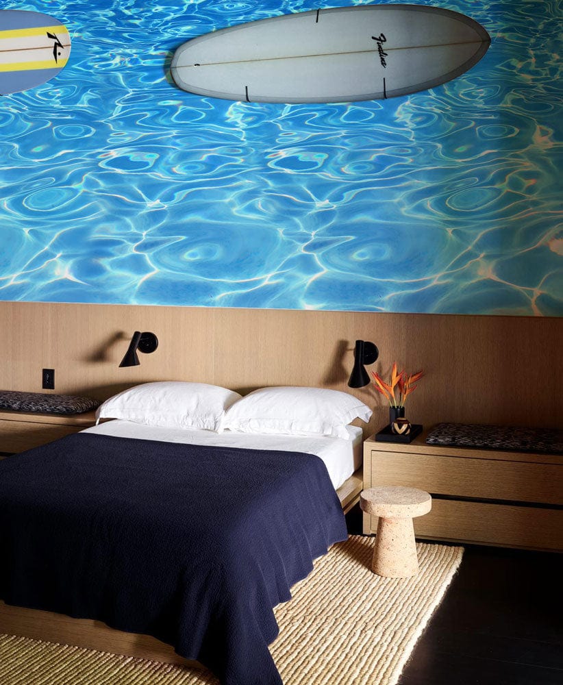 Vibrant Ocean Blue Water Ripple Wallpaper, modern bedroom, wooden furniture, cosy rug, stylish Décor.