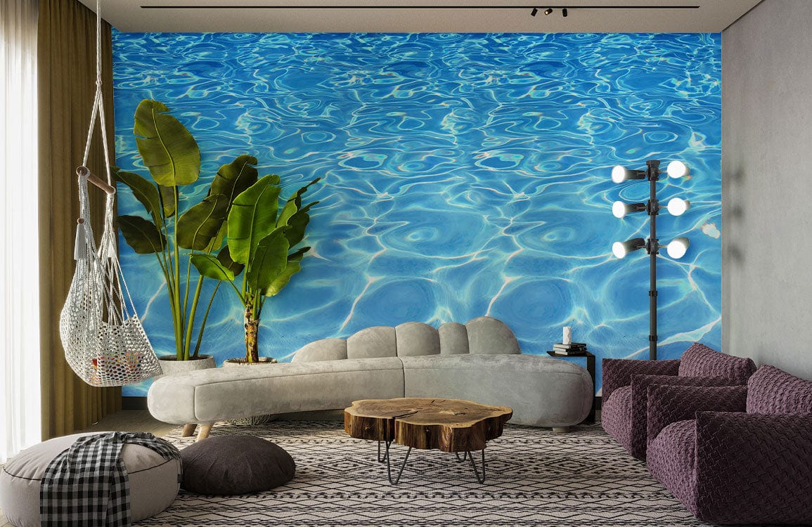 Vibrant Ocean Blue Water Ripple Mural Wallpaper, grey sofa, purple chairs, modern living room decor.