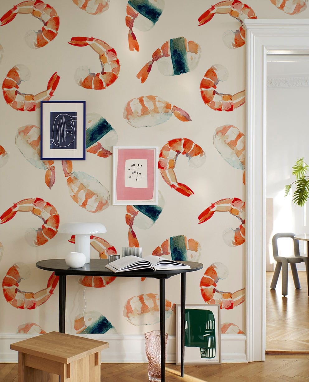 Vibrant Watercolour Seafood Pattern Wallpaper, orange chair, black round table, light wood flooring, nautical Décor.