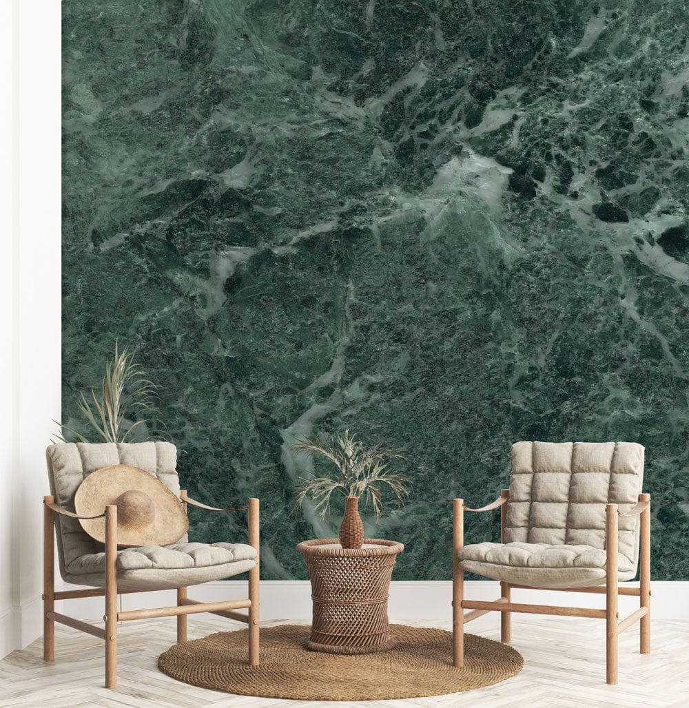 Luxurious green marble effect wallpaper in modern living room with beige chairs and wicker accents.