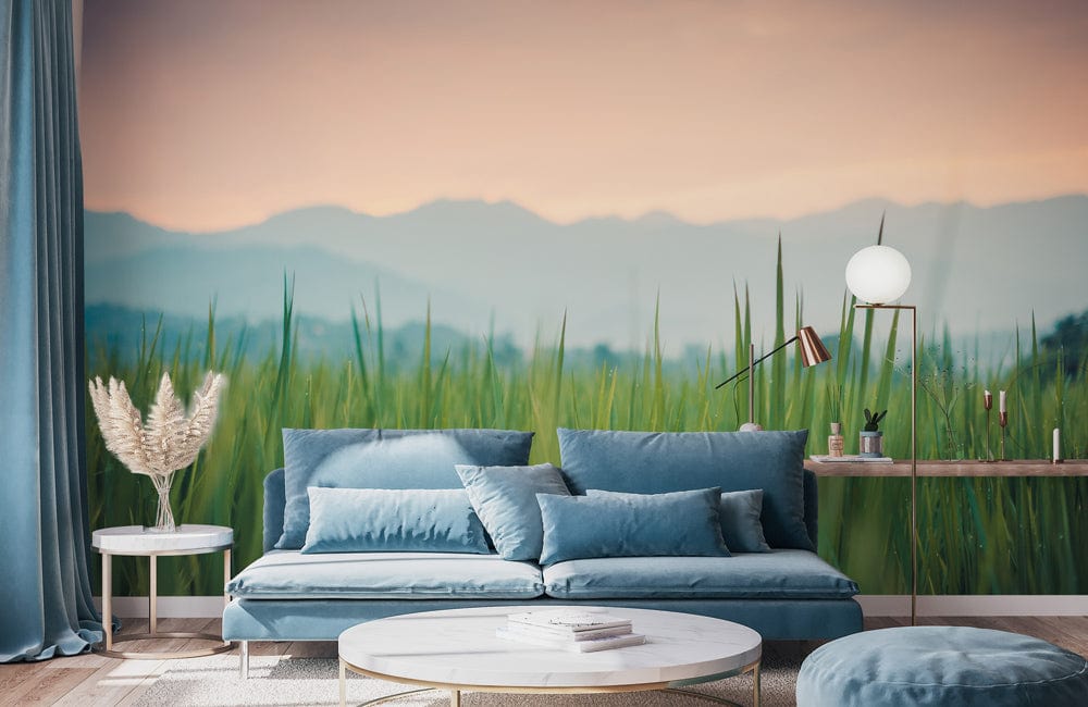 Serene Pastel Sunset Mural features a blue sofa, round tables, and soft lighting in a cosy lounge.
