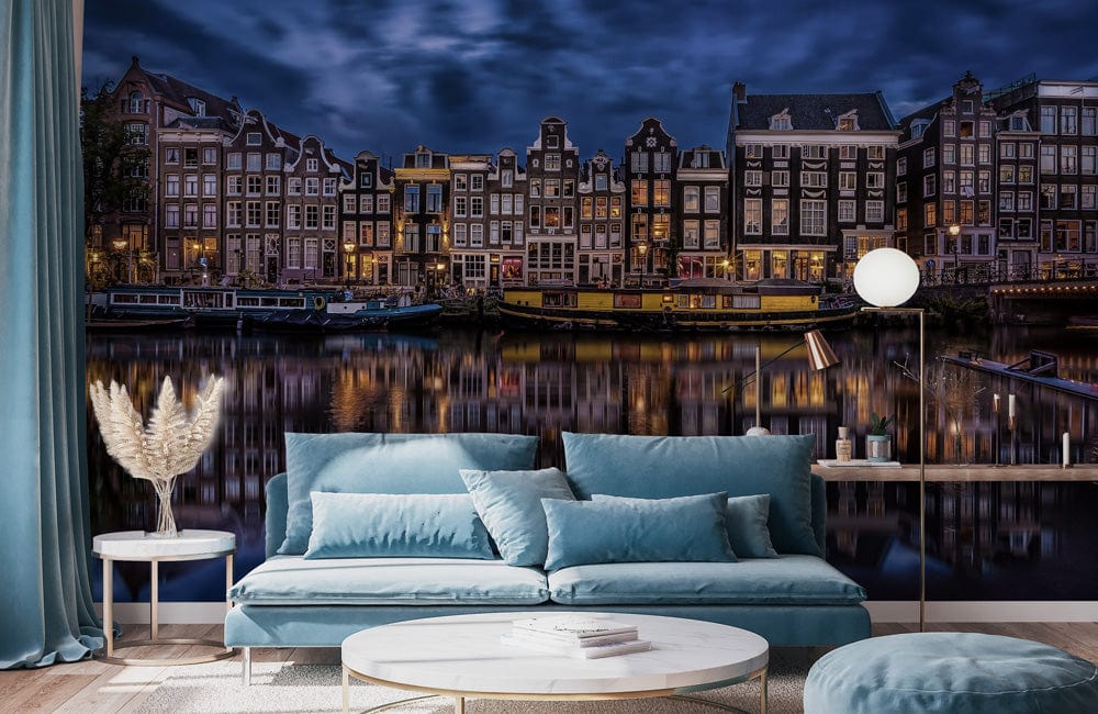 Enchanting Amsterdam mural wallpaper, blue sofa, modern living room, light wood flooring, night cityscape decor.