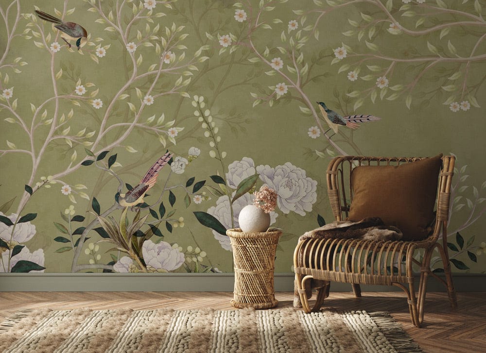 Elegant Green Chinoiserie wallpaper with birds, blossoms; vintage botanical mural, featuring rattan chair, rug.