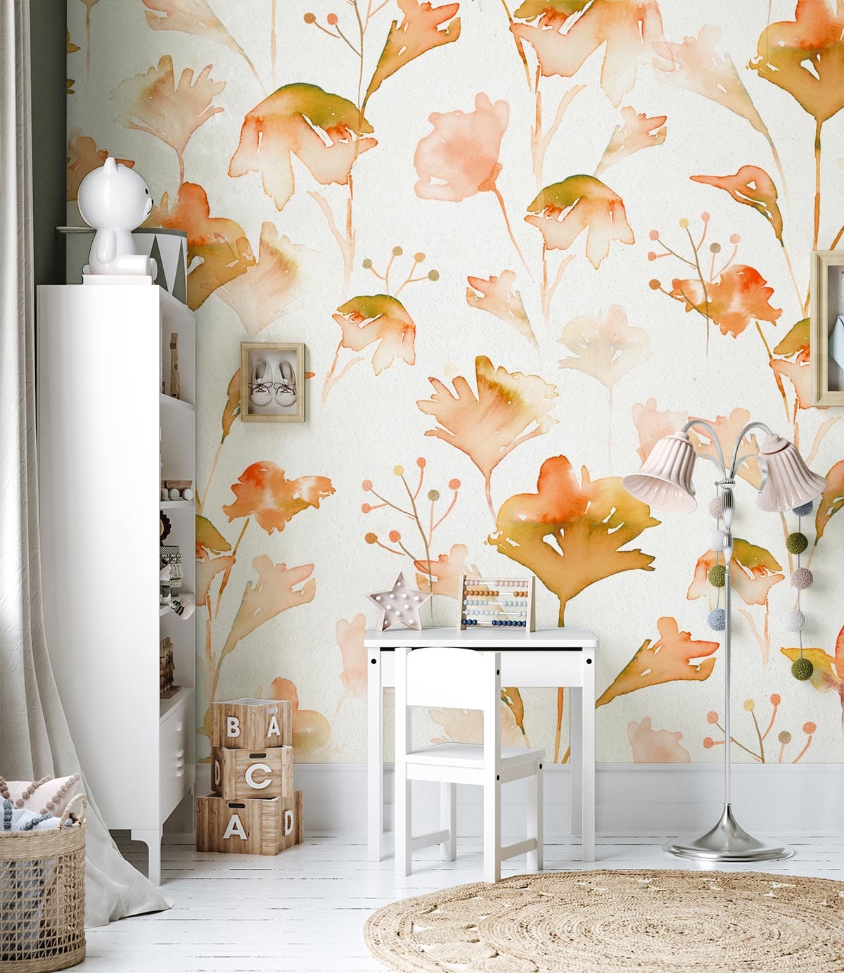 Autumnal floral watercolour wallpaper in nursery with white furniture and rustic round rug.