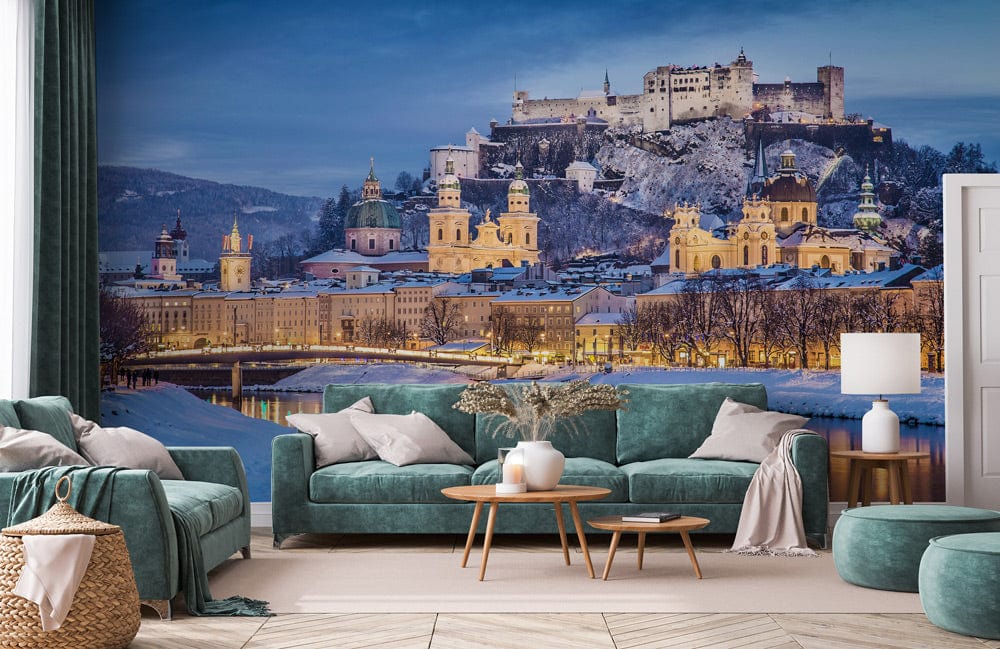 Living room with teal velvet sofas, wooden coffee table, and Enchanting Winter Castle mural wallpaper.