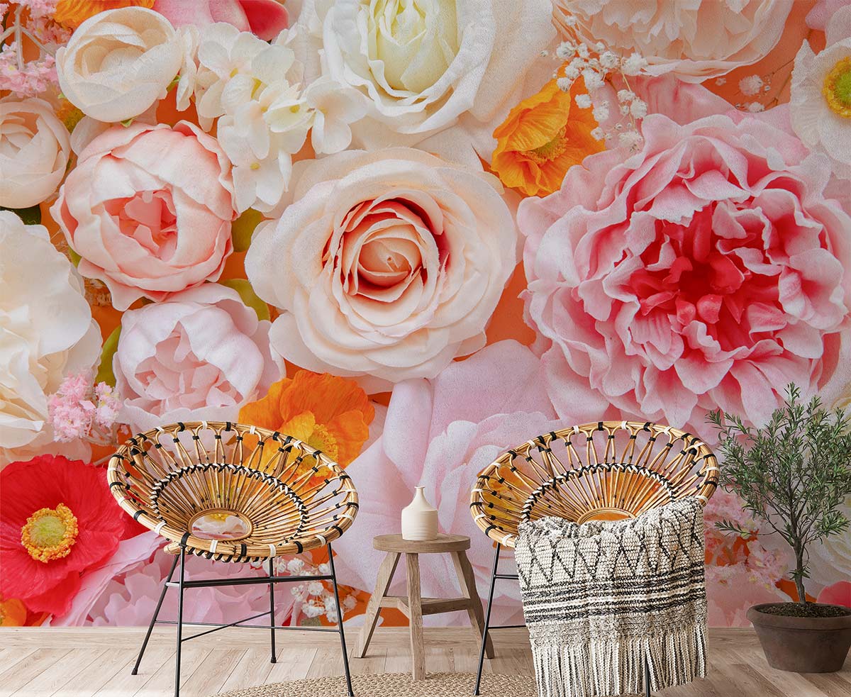 Pastel Blossom Harmony Floral Mural Wallpaper in pink and peach, wicker chairs, wooden floor, cosy room.
