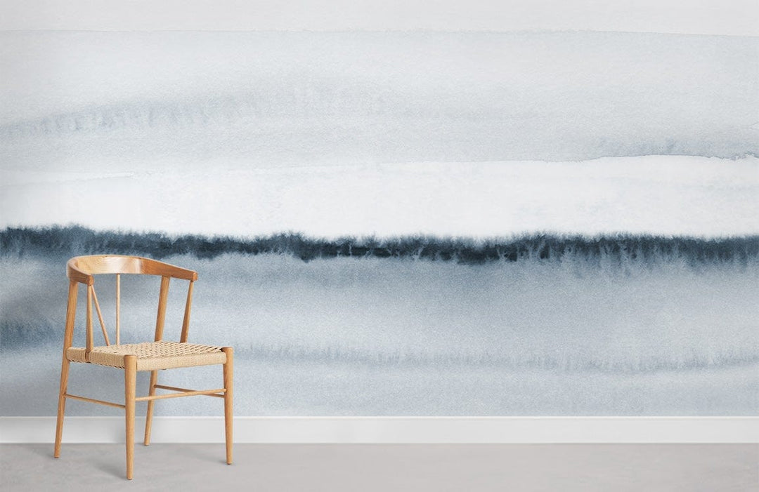 Serene Blue Watercolour Horizon Mural Wallpaper in modern interior with wooden chair, grey flooring.