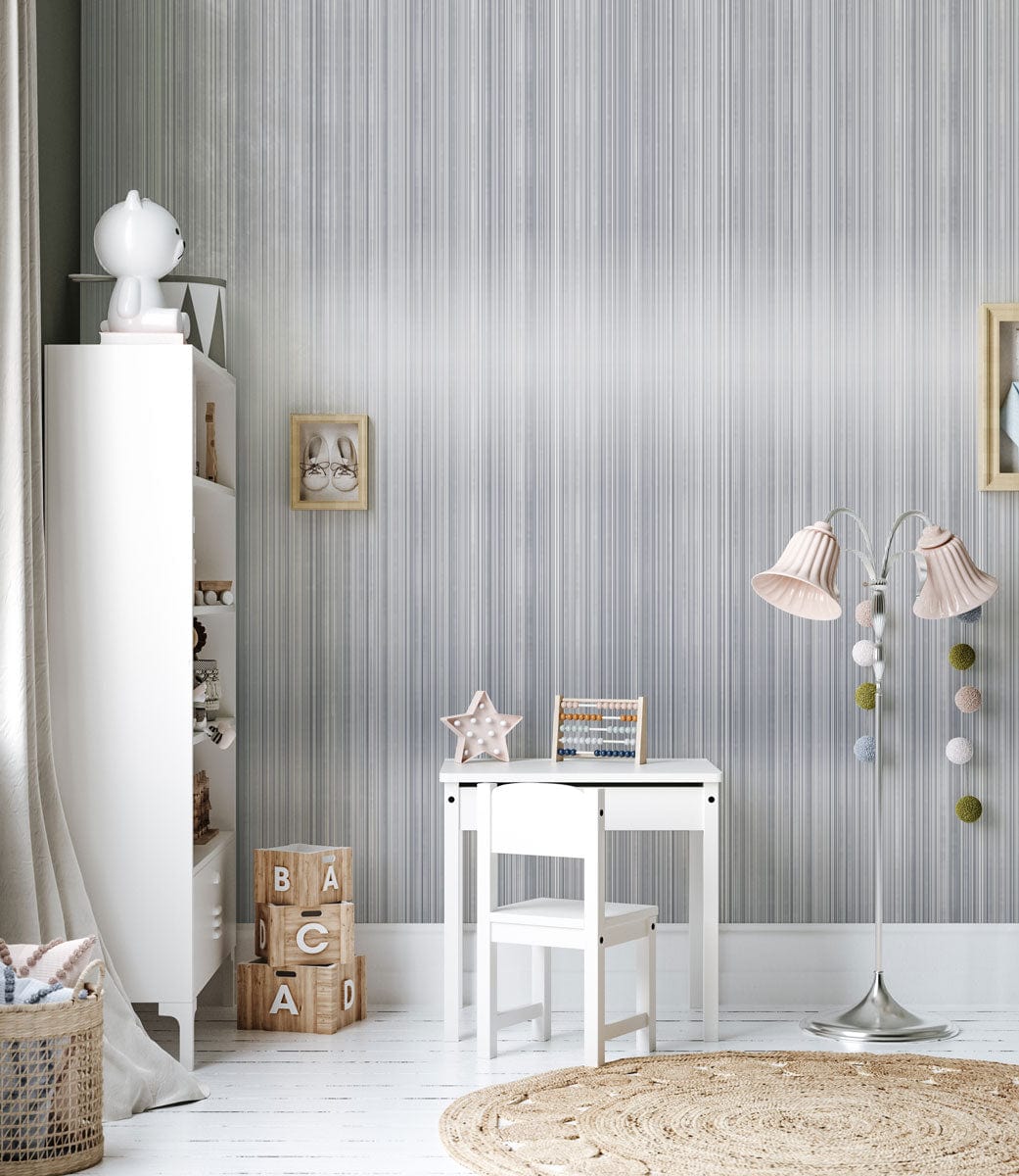 Elegant grey striped wallpaper with white shelving, child's table and chair, stylish floor lamp.